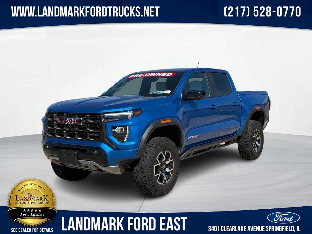 2024 GMC Canyon 4WD Crew Cab AT4X in Dynamic Blue Metallic — front three-quarter view