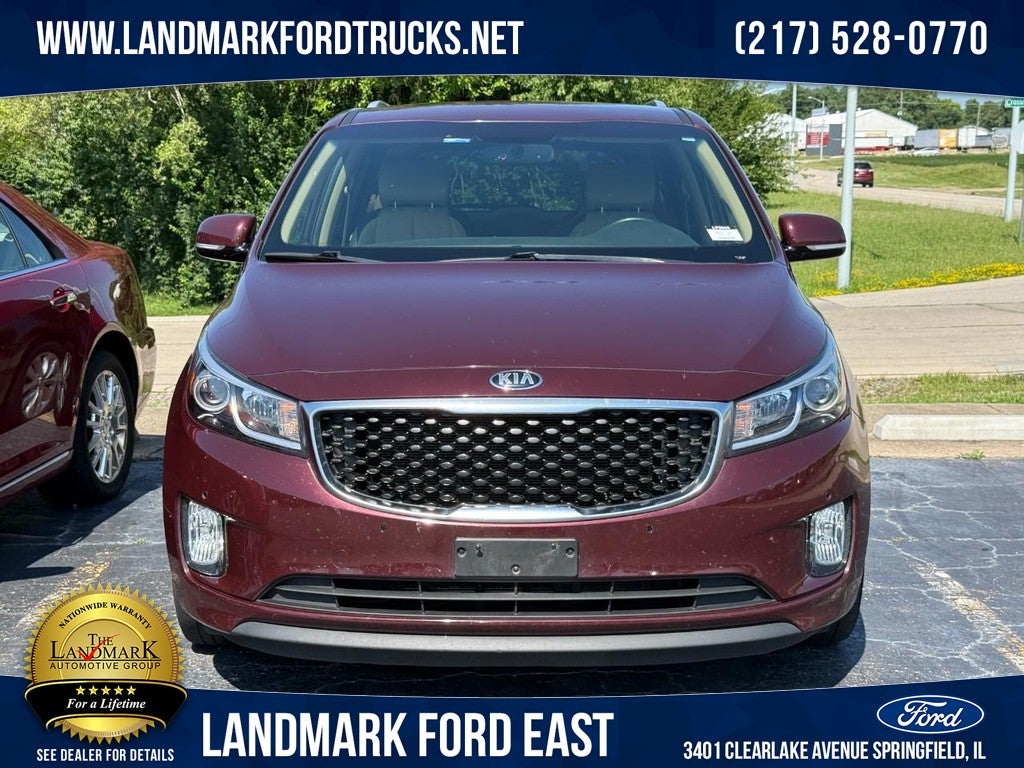 2017 Kia Sedona EX FWD in Venetian Red — front three-quarter view