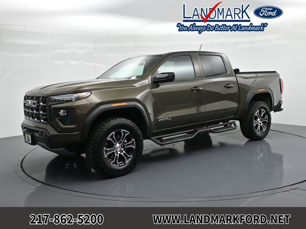 2024 GMC Canyon 4WD Crew Cab AT4 in Deep Bronze Metallic — front three-quarter view
